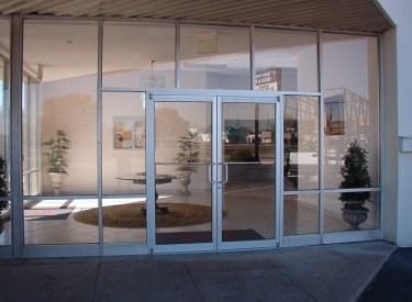 Glass storefront entrance with double doors